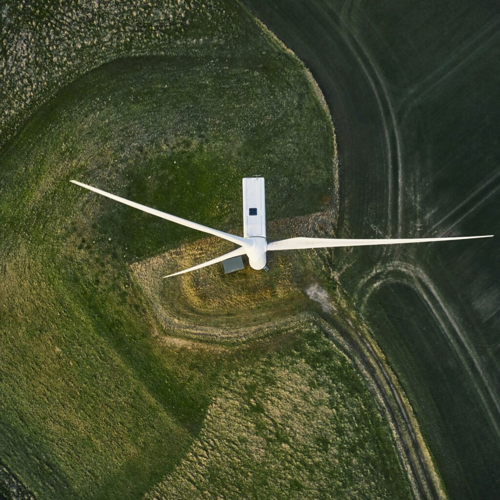 Night scene with wind mills. Wind turbines generating renewable energy. Aerial shot