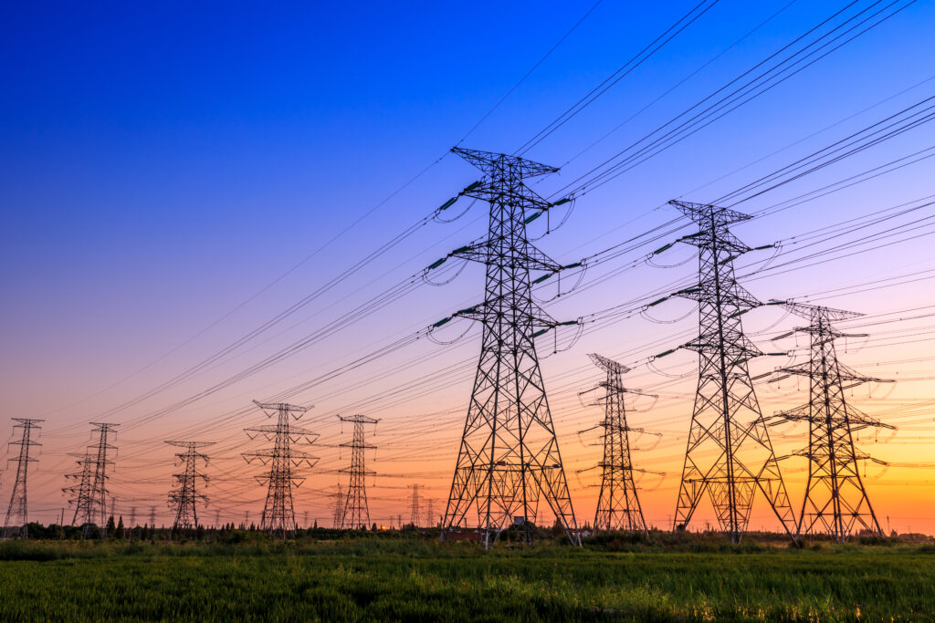 High voltage electricity tower sky sunset landscape,industrial background.